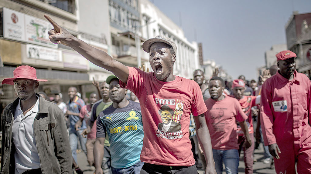 Supporters protest against alleged widespread fraud by the election authority after the announcement of election's results, in the streets of Harare on Wednesday 