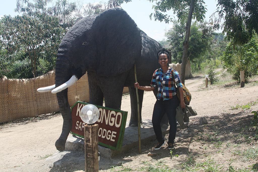 A tourist at Kikorongo Safari Lodge in Kasese district admires an elephant sculpture at the entrance of the hotel, February 2020. Photo by Felix Basiime (2)