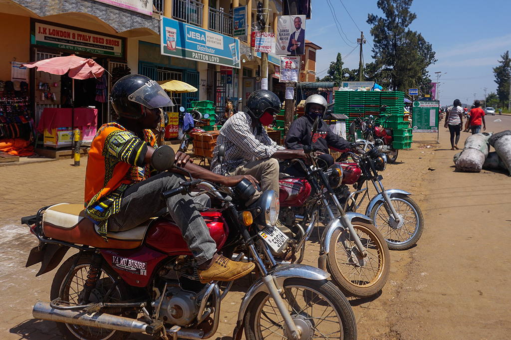 Julius Kisembo (from left), Ashraf Muvabulaya and John Bakule await passengers in Wakiso district, just outside Kampala, the capital.