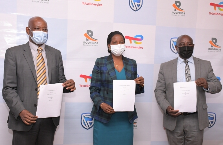 Total Uganda, Stanbic Bank and Roofings Chief Executives shortly after signing partnership