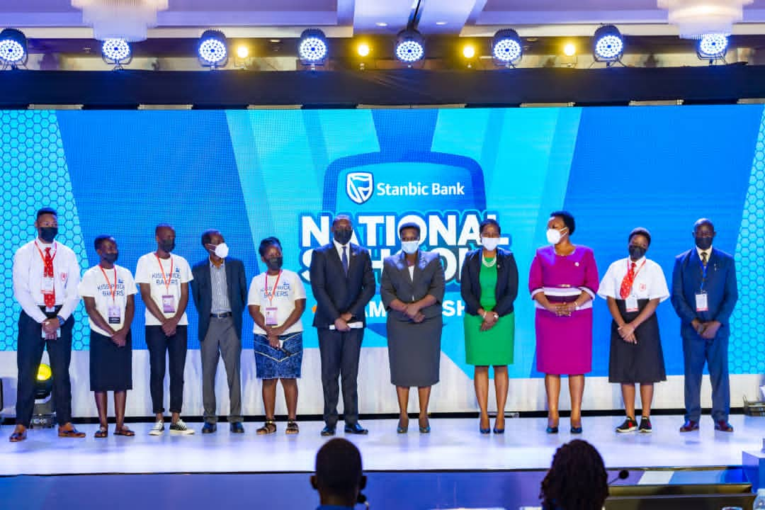 Guest of Honor, Vice President Jessica Alupo, Stanbic Bank CEO Anne Juuko pose for a picture with some of the participating students and teachers (PHOTO/Courtesy)