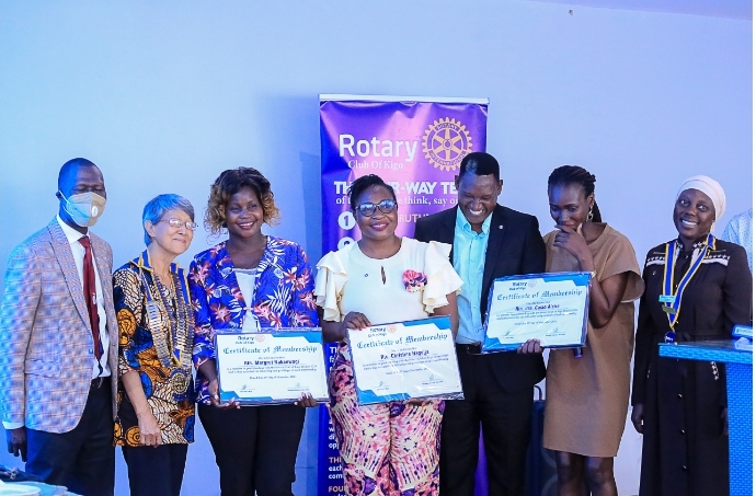 L-R PAG Sam Mwanje, DG Young Kimaro, Nakanwagi Margaret, Christine Naggujja, CP Dick Rwegaba, Director Membership Joweria and CMP Aziidah Nandawula during the induction of the new Rotarians.