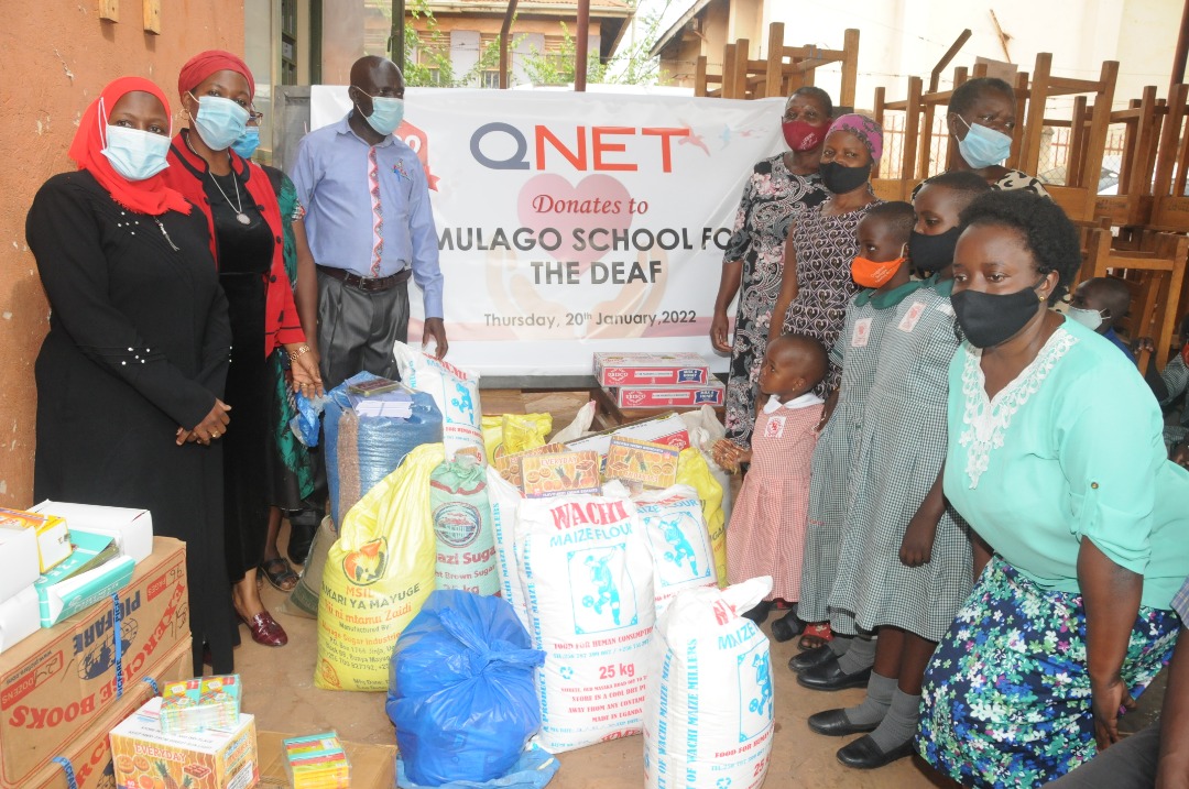 QNET Independent Representatives (in Green Shirts) providing goods to the Mugalo School for the Deaf (PHOTO /Courtesy)