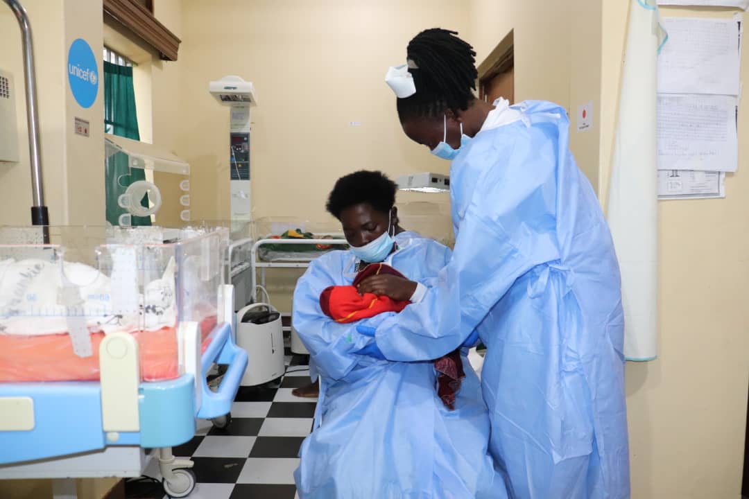 Natukunda being supported by the midwife to breatfeed her baby (PHOTO/Courtesy).