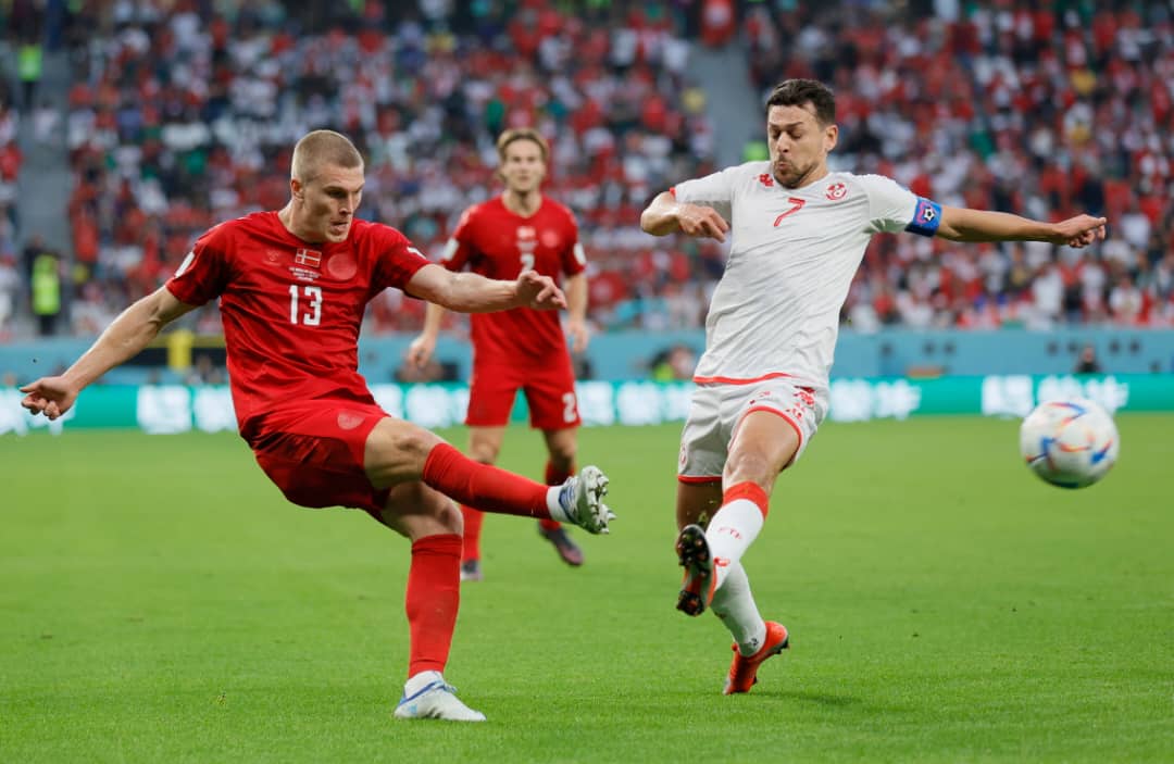 Rasmus Kristensen (L) of Denmark in action against Youssef Msakni of Tunisia during the FIFA World Cup 2022 group D soccer match between Denmark and Tunisia at Education City Stadium in Doha, Qatar, 22 November 2022.  EPA/Ronald Wittek