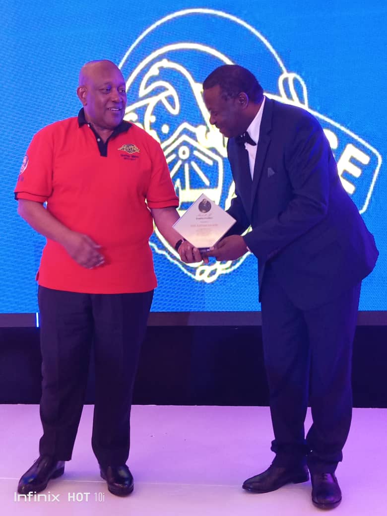 Prof. Kaleebo received the award bfeom MTN Chairman Charles Mbire