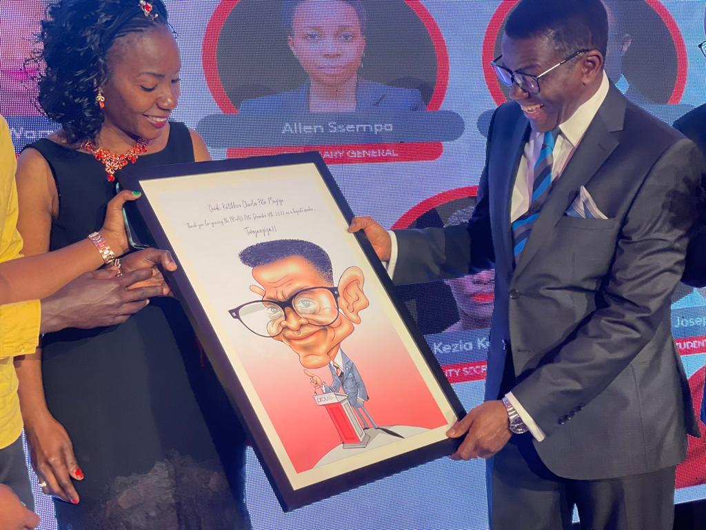 The Katikkiro of Buganda, Owek. Charles Peter Mayiga receiving a token of appreciation from the PRAU Governing Council led by Stephen Mwanga.