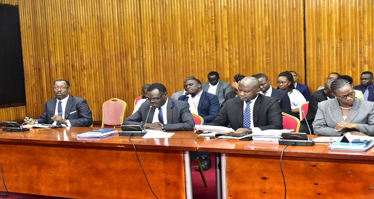 Former NSSF MD, Richard Byarugaba (L) appearing before the committee investigating the fund