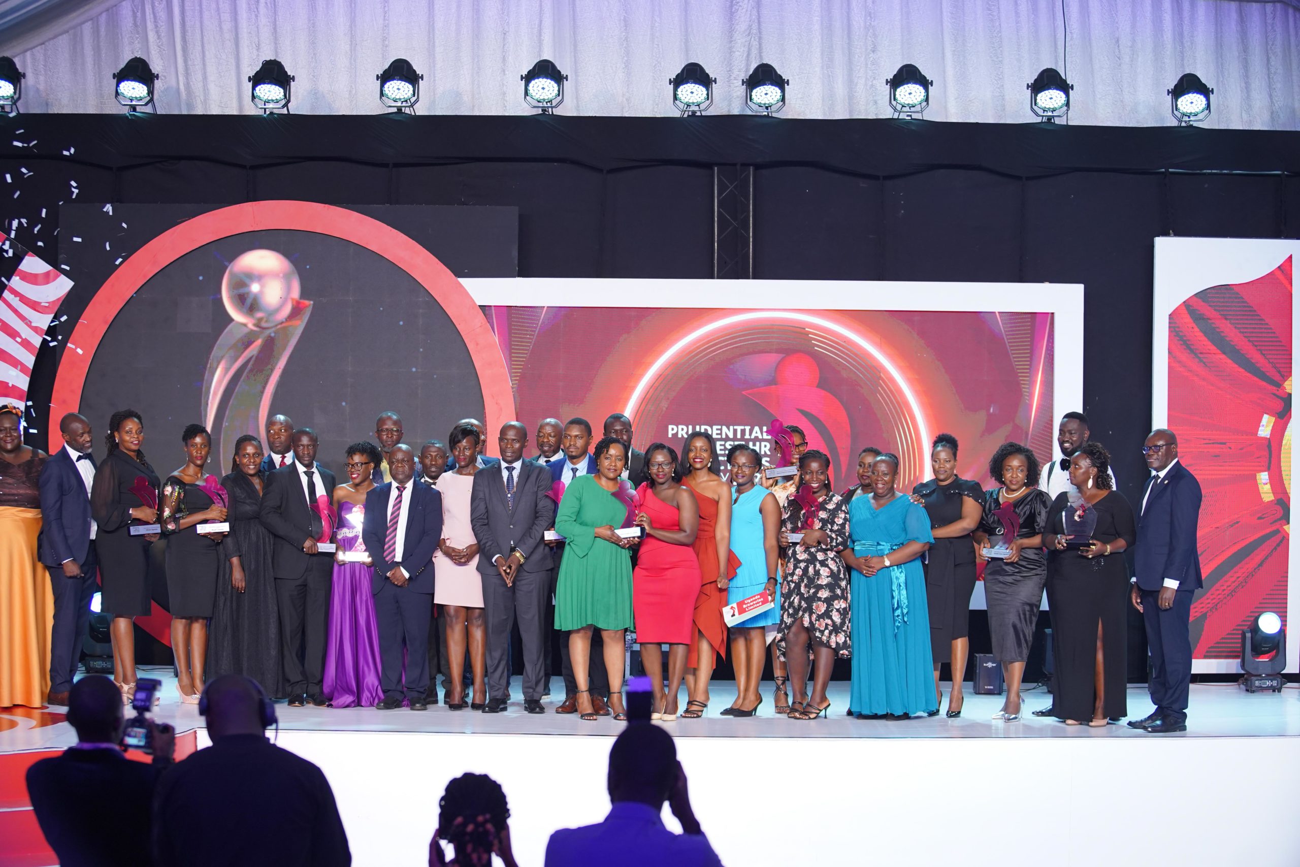 The state minister for Kampala, Kabuye Kyofatogabye (2nd R), Apollo Makubuya (3rd L) Board Chairman of Prudential Uganda, Tetteh Ayitevie (2nd L) Chief Executive Officer, Prudential Uganda, Uthman Mayanja (L), Country Senior Partner, PwC Uganda and other officials from Prudential during the launch of the 2022 Prudential Best HR Practices Survey Report at Kampala Serena Hotel on 24th March 2022. The Prudential Best HR Practices Survey is a human capital and talent management survey aimed at giving employers an opportunity to hear from their employees on how they (the employees) assess their organization’s HR practices.