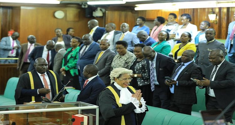 Speaker Among greets Members of Parliament as she makes her way to chair the sitting of the House