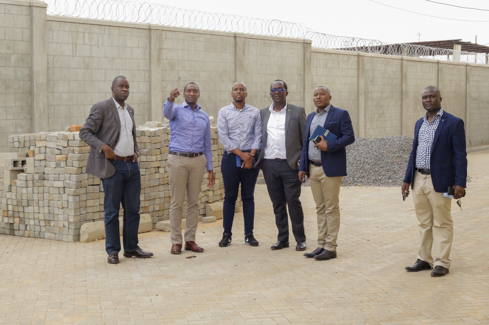 L-R The Acting Managing Director Sam Ntulume, Dr Peter Kyabaggu, the Director Bukoola Chemicals Industries , Head of Treasury Dennis Damba, Chief Business Officer Edward Gibson Nangono, Head of Corporate Banking Paul Bagoye and the Corporate Relations Manager Ian Mugenyi.