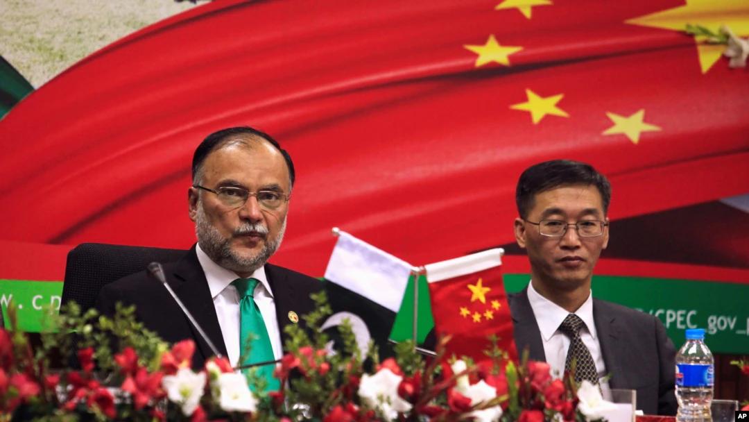 Ahsan Iqbal, left, Pakistan's minister of planning and development, and Yao Jing, Chinese ambassador to Pakistan, attend the launch of a CPEC long-term cooperation plan in Islamabad, Dec. 18, 2017. The Afghan Taliban have secured an agreement to extend CPEC to Afghanistan