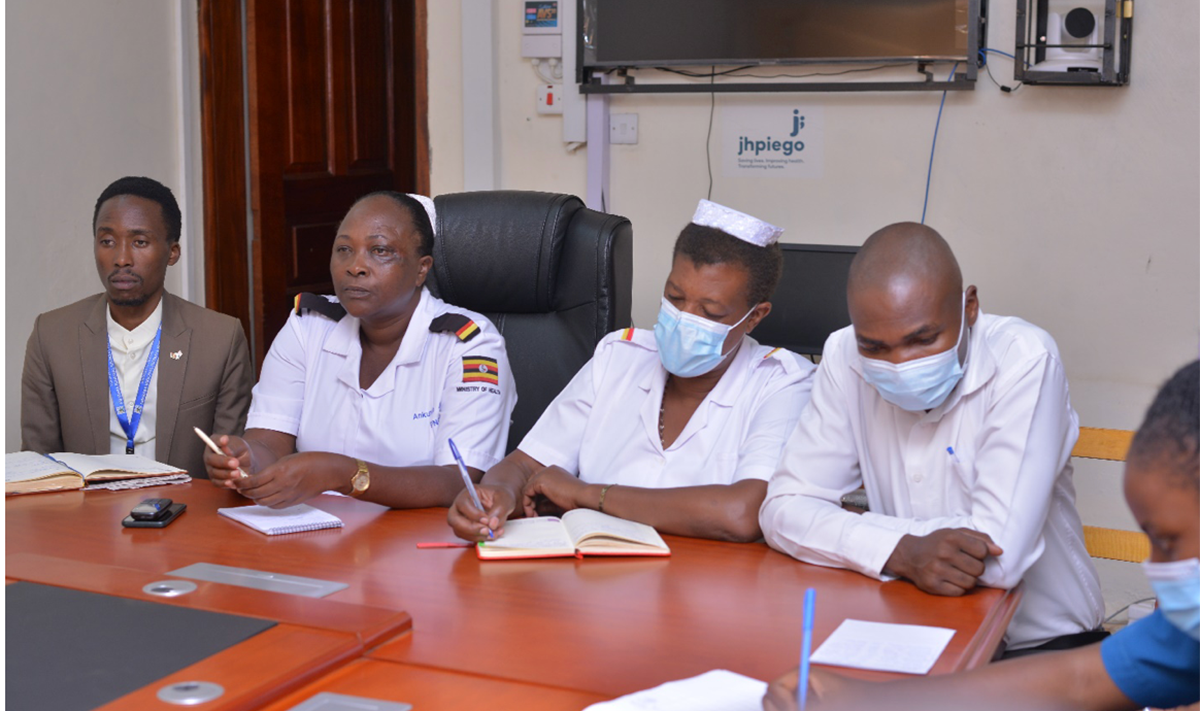 From left: Halson Kagure the Hospital Public Relations Officer, Mrs Juliet Ankunda, MRRH PNO and Str Medle Gasumuni the Incharge of Infectious Diseases Treatment Center orienting internship students of Nursing in the hospital board room.