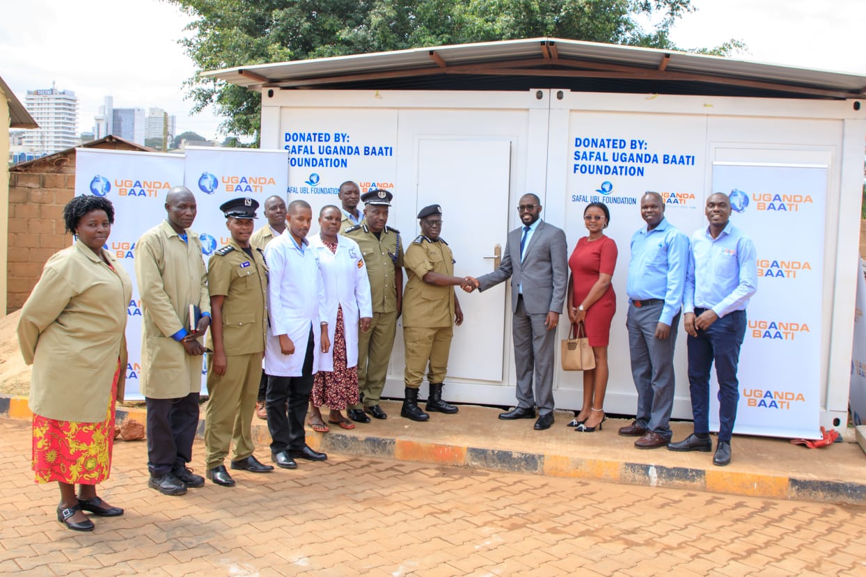 (L-R): CP Kirungi Sulaiman, the Commissioner of Police Duty Free Shop & Supermarkets and Uganda Police team and Ian Rumanyika, the Head External & Corporate Affairs and Uganda Baati team pose for a photo during the handover