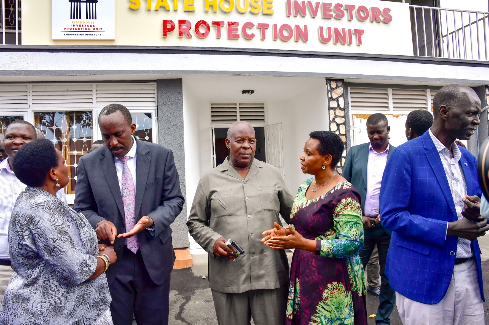 Col. Edith Nakalema and URA Commissioner General John Musinguzi chatting with some of the local investors and policy makers during a meeting at State House Investors Protection Unit in Kampala on Wednesday