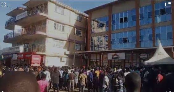 UPDF, police, private security guards and staff pictured at Equity Bank Branch in Soroti District following an attempted robbery on April 23, 2024