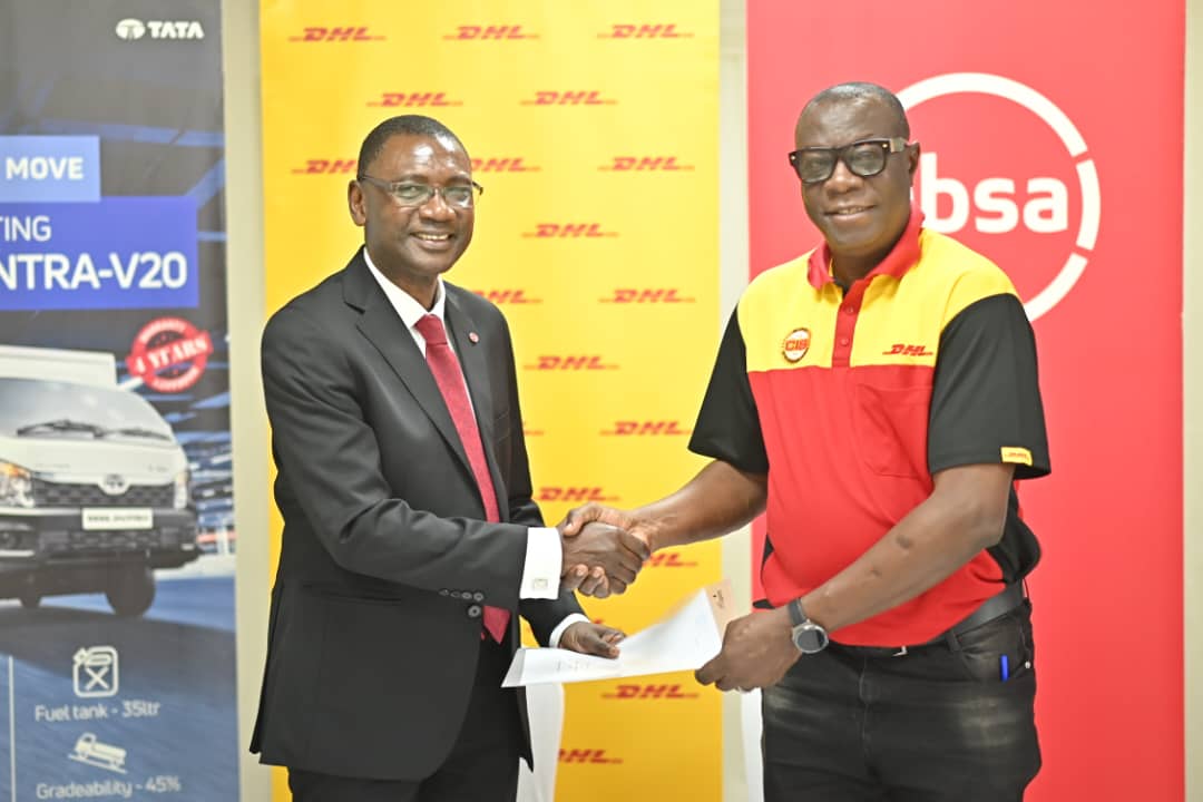 Musa Jallow, Retail and Business Banking Director, Absa Bank Uganda (left), and Joseph Odole, Country Manager, DHL Uganda (right), shake hands after announcing a partnership to support 800 SMEs in accessing export markets through the 'Growing Beyond Borders' Entrepreneurial Training Programme.