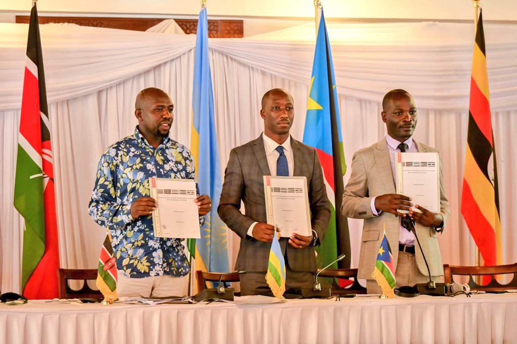 L-R: Hon. Kipchumba Murkomen (Cabinet Secretary, Ministry of Roads and Transport, Kenya), Hon. Jimmy Gasore (Minister of Infrastructure, Rwanda), and Hon. Fred Byamukama (Uganda's State Minister for Transport) display a signed report following the Joint Ministerial Committee meeting for the development of the Standard Gauge Railways in Mombasa, Kenya, on Friday, May 3, 2024.