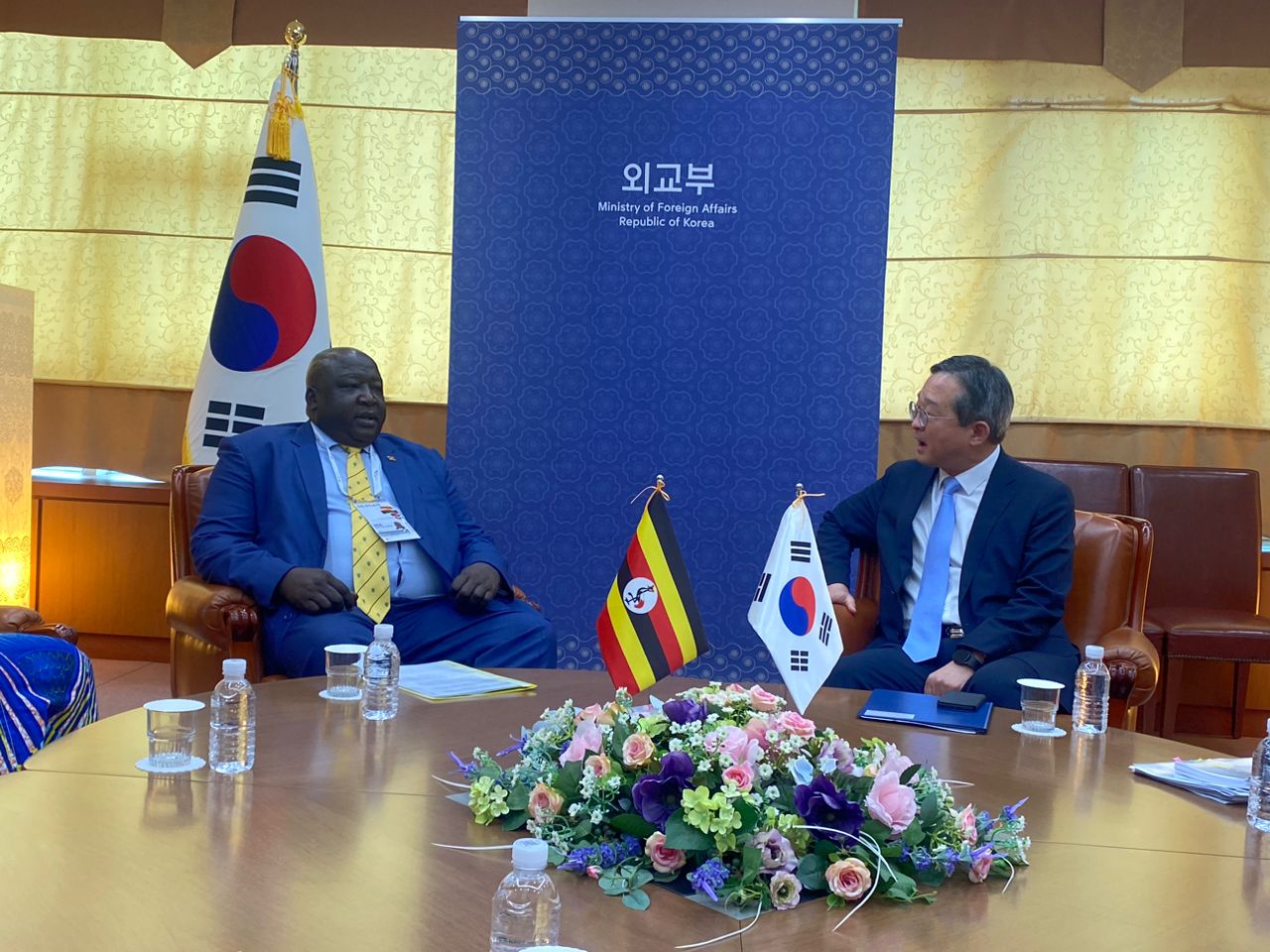 Uganda's Minister of State for Foreign Affairs, Okello Oryem, and South Korea's Deputy Minister of Foreign Affairs, Chung Byung-won, sit in discussion during a bilateral meeting in Seoul, Korea. The two leaders engaged in talks to strengthen bilateral relations and signed several memoranda of understanding to enhance cooperation in trade, investment, and capacity building.