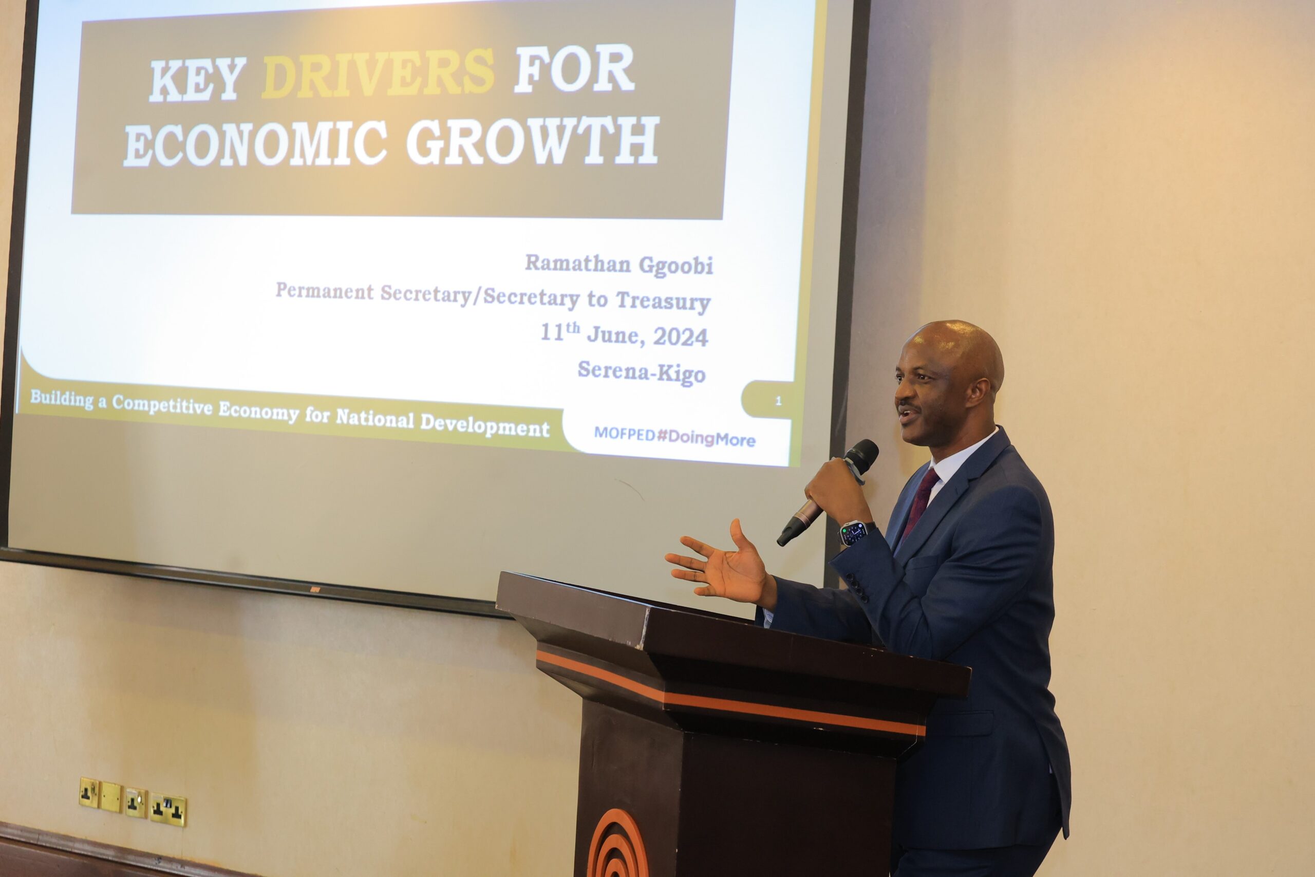 Finance Permanent Secretary Ramathan Ggoobi addressing Ugandan ambassadors, tasking them to attract credible investors and secure markets for Ugandan exports, at a retreat in Kampala (PHOTO/MOFA)