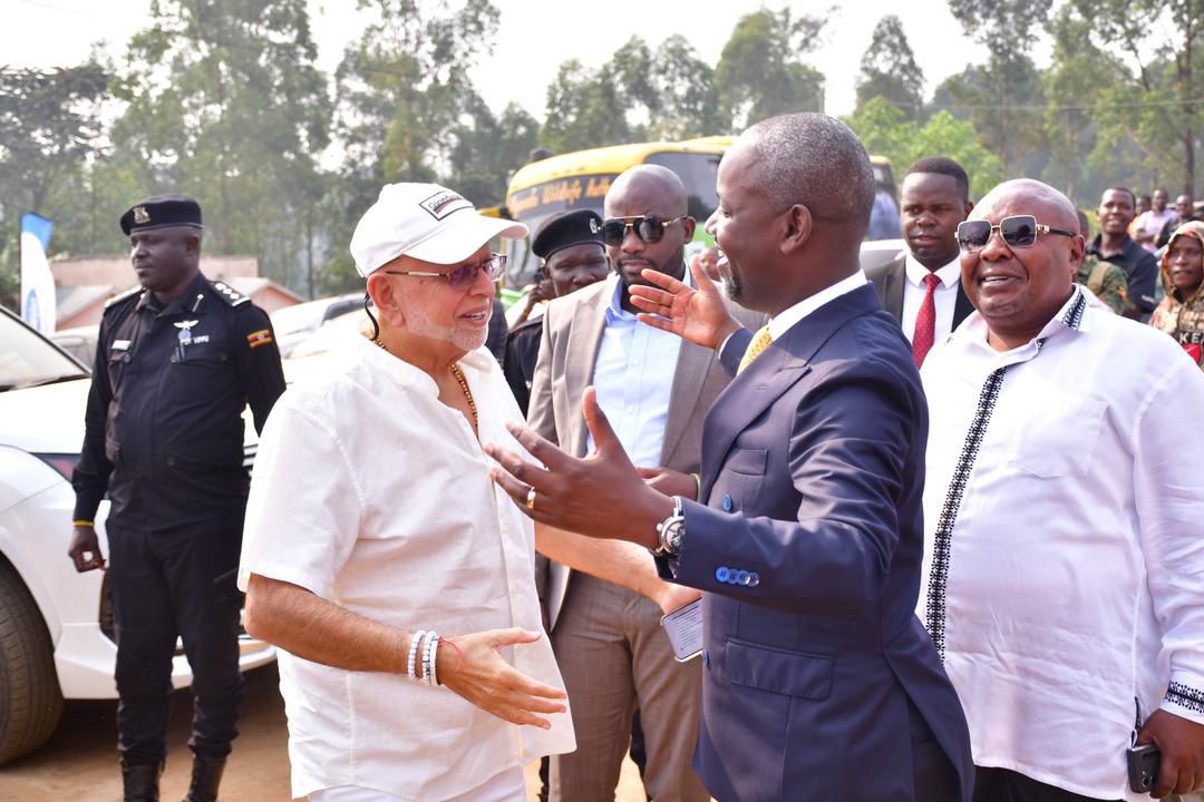 Deputy Speaker Thomas Tayebwa greets business mogul Sudhir Ruparelia with a hearty hug, as he arrives for the dedication ceremony of the newly constructed St. Karoli Lwanga Kigarama Catholic Church in Mitooma District. Tayebwa had earlier revealed that Sudhir was among the friends who contributed significantly to the church's construction, raising Shs1.7 billion in just one meeting. 