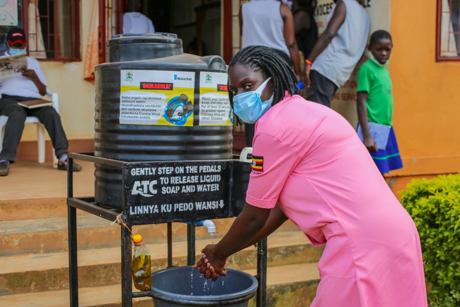 A nurse takes a crucial step in preventing the spread of infections, washing her hands thoroughly at a healthcare facility in Kampala, Uganda, as the country marks Global Hand Washing Day