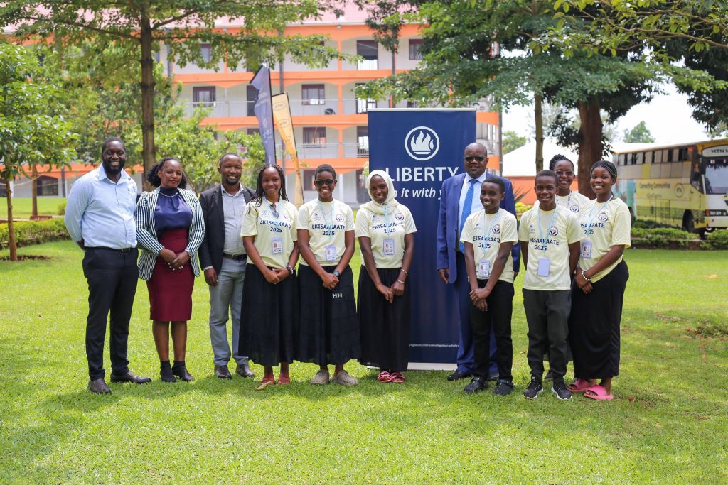 Liberty Uganda Team with some students during Liberty day at Ekisaakate Kya Nnaabagereka.Far right is Mr Peter Makhanu, MD Liberty General Insurance