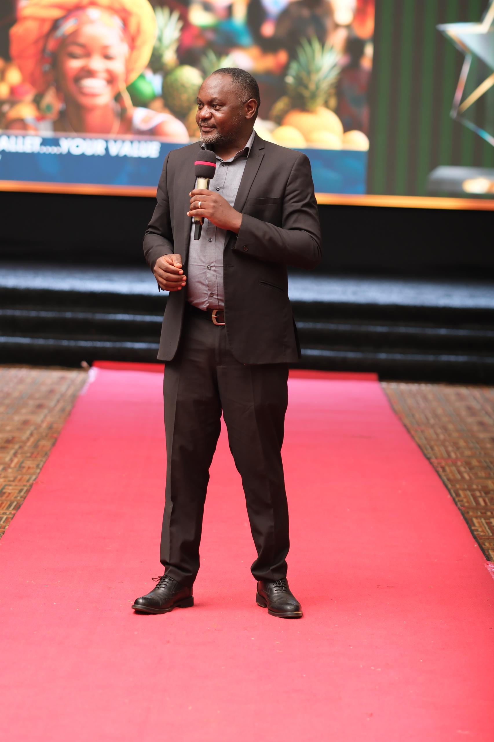 Apollo Mboowa, NSSF Financial Literacy Manager, emphasizes the importance of financial literacy at the Old Mutual Investment Group's Annual Agents Awards ceremony