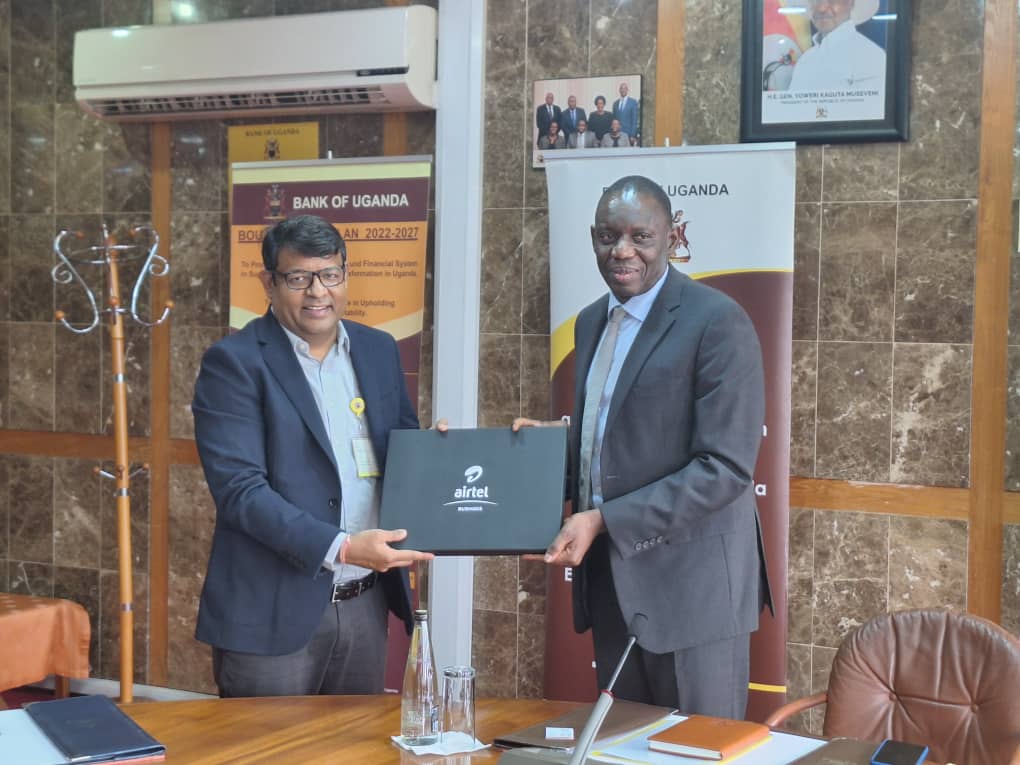 Mr. Soumendra Sahu, MD, Airtel Uganda (L) hands over an Airtel Uganda package to Dr. Michael Atingi-Ego, the newly named Governor of the Bank of Uganda. This was during a courtesy visit paid to the Governor by the Airtel Uganda Ltd and Airtel Mobile Commerce Ltd team.