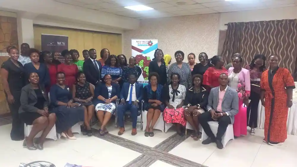 Dr. Hillary Kisanja (center) poses with women entrepreneurs who participated in the Women's Leadership for Financial Inclusion and Economic Recovery (WLIFI) project event