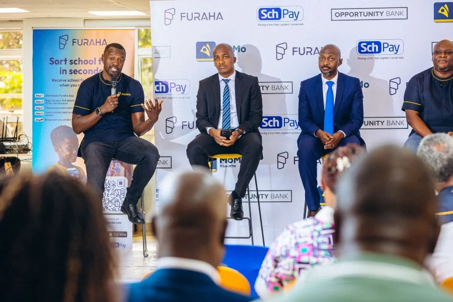 (L-R) Yustus Aribariho, Furaha Co-Founder; Owen Amanya, Opportunity Bank Uganda CEO; Brian Collins Amanyire, Opportunity Bank CFO; and Denis Musinguzi, Furaha CEO, formalize their partnership