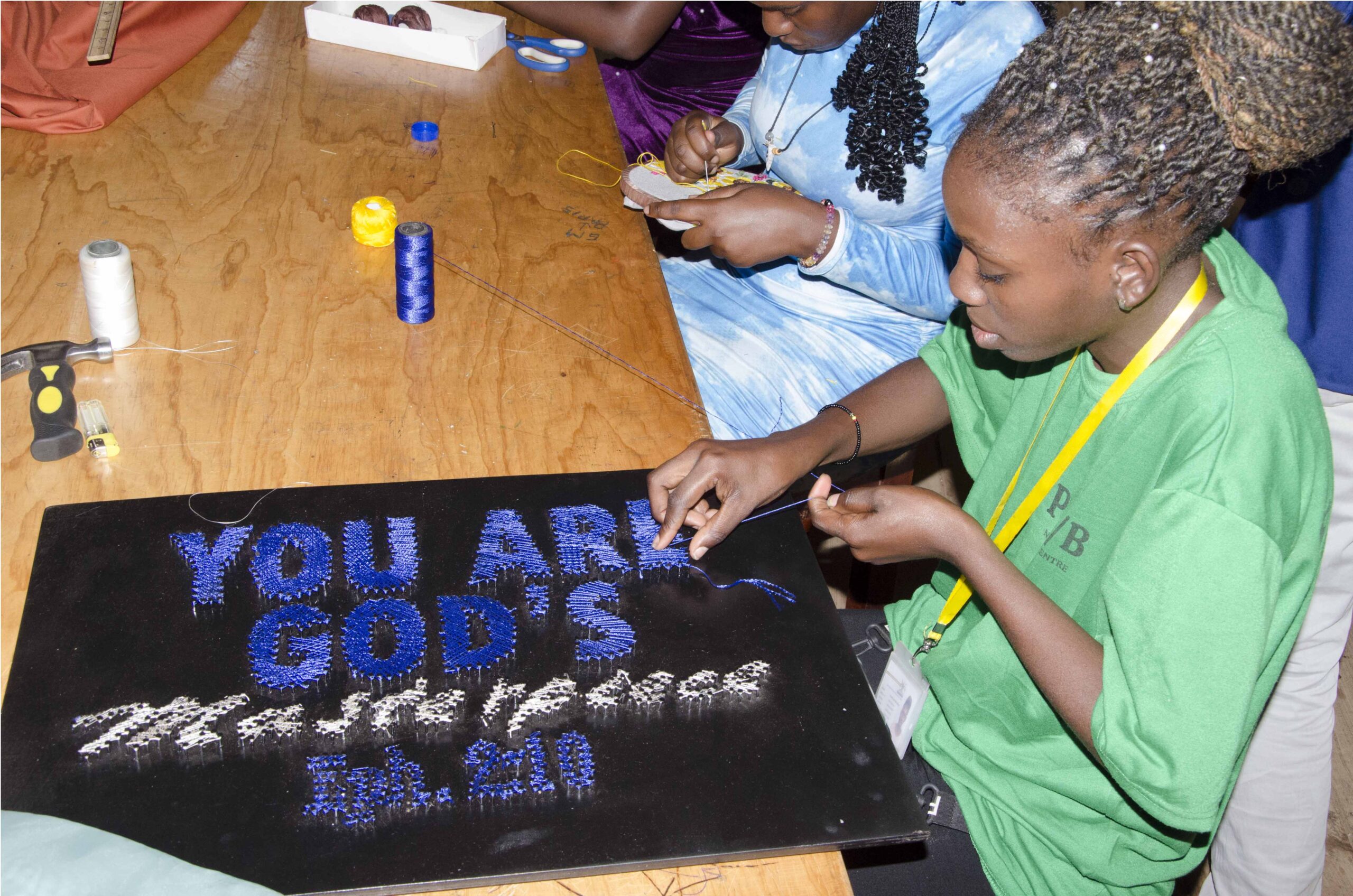 A student displaying her skill in making string art (PHOTO/ COLLEB MUGUME)