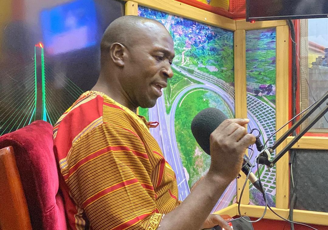 Peace Service Ambassador Milton Kambula speaks during a past event at a local radio station in Kampala, Uganda