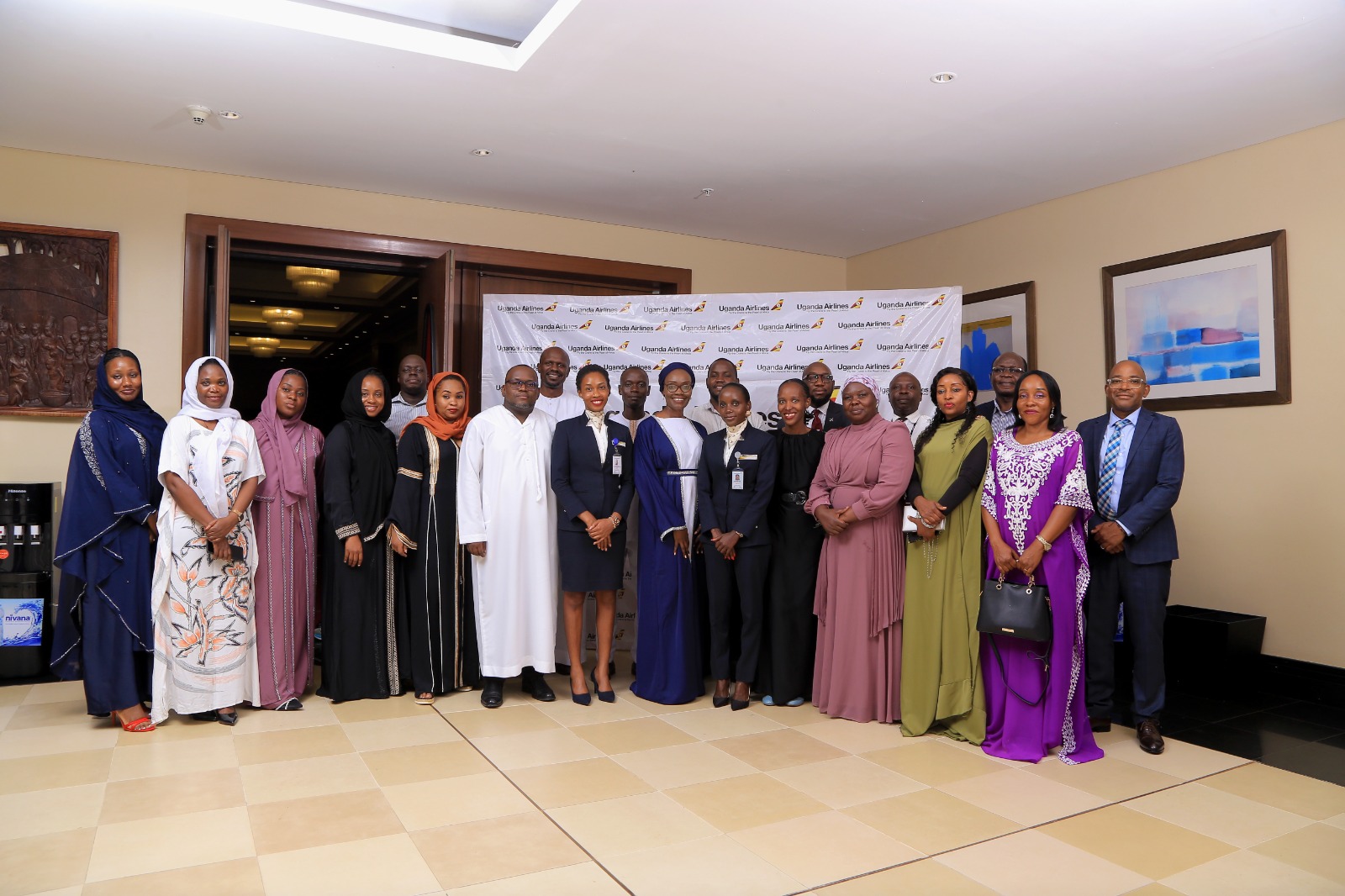 Uganda Airlines team poses for a group photo during the Iftar dinner hosted for the Muslim community in Kampala, showcasing the airline's commitment to building strong relationships with its stakeholders